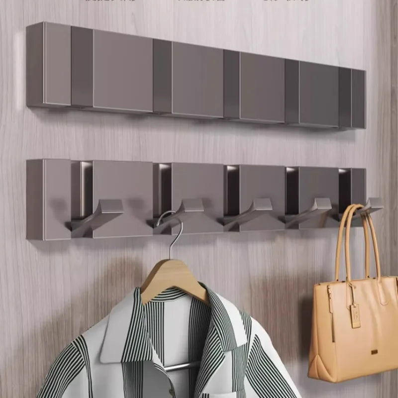 Ganci pieghevoli nascosti da 3/4/5 ganci sul muro dietro il foro di colpito da appendere di lusso